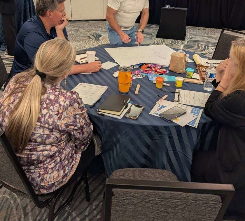 Nonprofit leaders working together at a workshop table